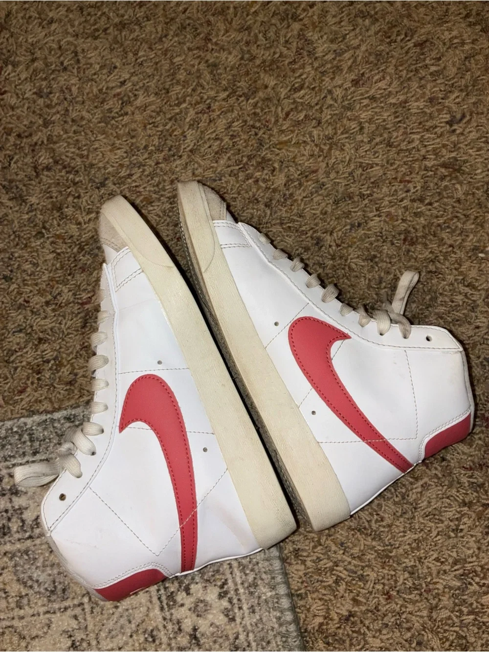 Nike Women's White High-Top Sneakers with Red Swoosh